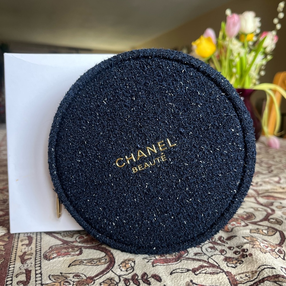 CHANEL round, lightweight navy and gold cosmetic bag